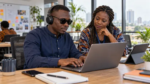 Illustrative accessibility test with a professional using a laptop and headphones alongside a facilitator.